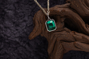 Jewelry - Women's retro-style necklace with a cubic green stone in a silver setting on a chain