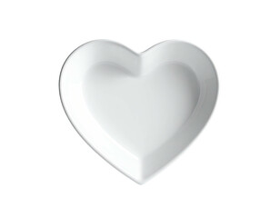 A white, heart-shaped ceramic dish, isolated on a black background