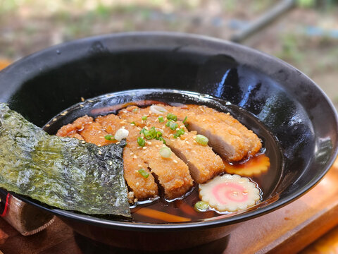 Tonkatsu Udon, Deep fried pork cutlet serving on the clear soup with Japanese big noodle