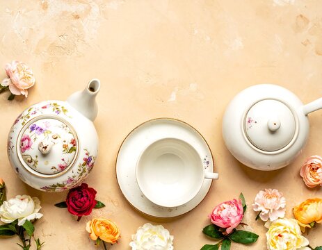 Elegant tea set with flowers on beige background - Powered by Adobe