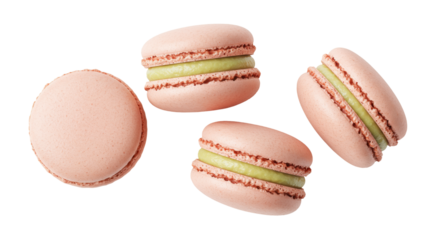 Four pink macarons with green filling isolated on transparent background, delicious French almond meringue-based confection for dessert