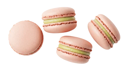 Fotobehang Macarons Four pink macarons with green filling isolated on transparent background, delicious French almond meringue-based confection for dessert  © Adrian