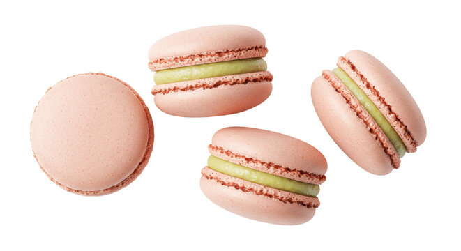 Four pink macarons with green filling isolated on transparent background, delicious French almond meringue-based confection for dessert