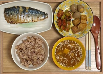 Warm and comforting jibbap (home-cooked Korean meal) with a spread of rice, soup, and banchan, offering a perfect harmony of flavor, tradition, and heartwarming nourishment in every bite.