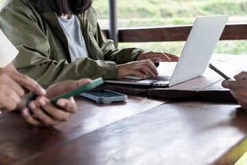 Female hands typing on laptop keyboard, close-up view, concept of work, study, online communication, and modern digital lifestyle.