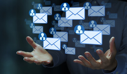 Email marketing. Mailing list and automated reply system. Businessperson holding mail icons.