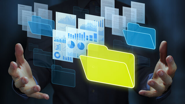 Document management system DMS and automated repository technology. Business person holding documents and folder icons.