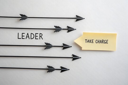 Creative representation of leadership with arrows directing towards a sticky note urging to take charge