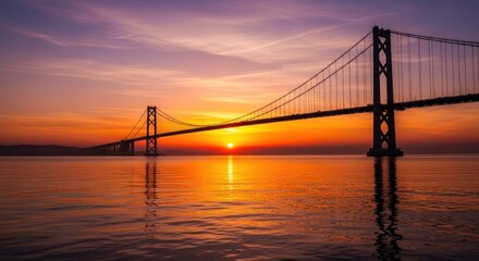 Vivid sunset paints the sky and water with warm orange and purple hues, reflecting a majestic suspension bridge silhouette 