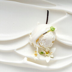 Creamy vanilla scoop with delicate orchid blossoms and bean vanilla ice cream vanilla bean