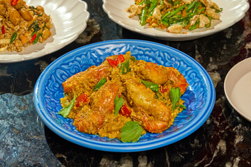 Authentic Thai Prawns Stir-fried with Yellow Curry Powder (Goong Phad Pong Karee) Isolated