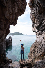 Beautiful Thai woman takes photos with beautiful tourist attractions, secret photo spots on Koh Sichang, Chonburi Province, Thailand.