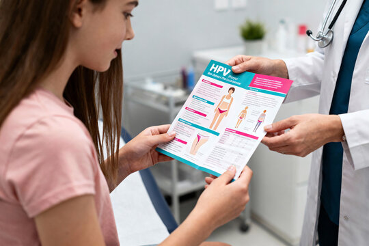 Bright gynecology consultation room with teenage girl reviewing HPV brochure, female doctor providing educational support in a modern, friendly healthcare environment. - Powered by Adobe