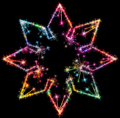 Kolorowe zimne ognie i fajerwerki układające się w kształt barwnej gwiazdy ośmio ramiennej na ciemnym tle. © Blue Pixel