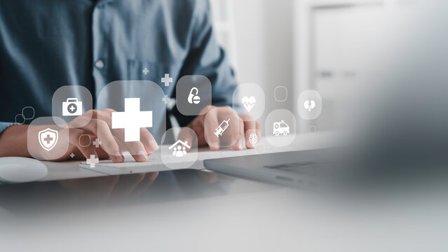 Medical service and Health Insurance business, Doctor using laptop computer with health care icons, medical technology background, telemedicine, virtual hospital, family medicine concept