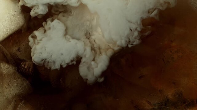Super Slow Motion Shot of Pouring Cream into Coffe with Ice at 1000fps.