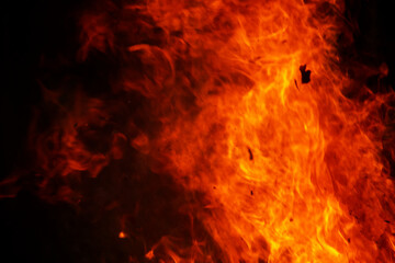 Close up burning flames on black background for graphic design or wallpaper.