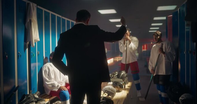 Ice Hockey Coach Standing in Front of Young Players in a Locker Room, Delivering an Inspiring Pep Talk. Young Team Listens, Gaining Confidence Before Heading onto the Arena