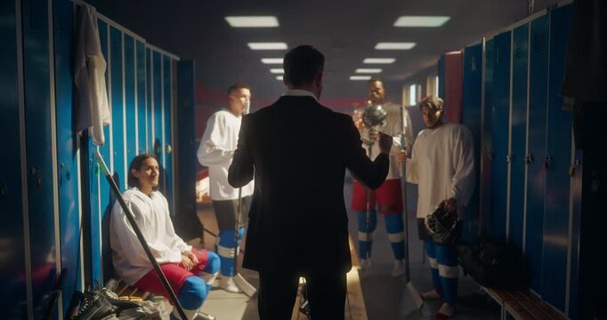 Diverse Hockey Team Gathered Around Their Coach in a Locker Room, Nodding and Clapping During an Encouraging Speech. Atmosphere is Uplifting, Building Team Spirit and Determination Before a Match - Powered by Adobe