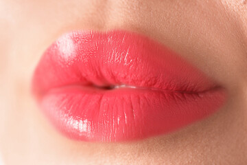 Fototapeta premium Woman with beautiful lipstick on her lips, macro view