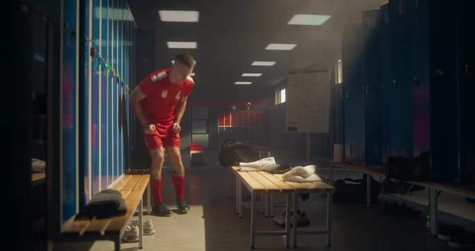 Young Football Player Enters Locker Room Furious, Tossing the Ball at the Wall with Force. His Body Language Shows Exhaustion, Defeat and Intensity After a Disappointing Game