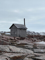 A lonely hut in the tundra on the shore of the Barents Sea, Russia