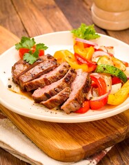 Sliced steak with roasted vegetables