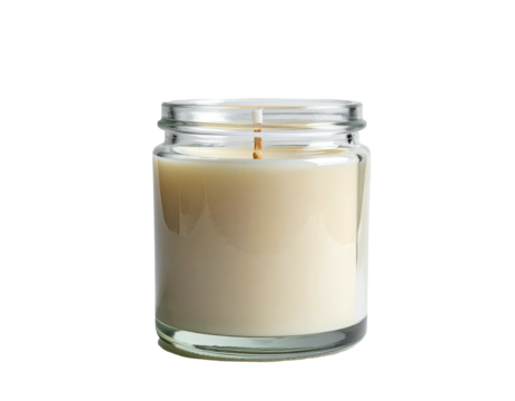 Close-up of a small, glass-jarred candle with a pale, creamy wax filling