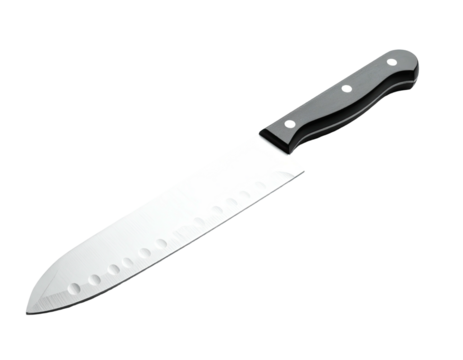 A large, shiny chef's knife with a black handle against a stark black background