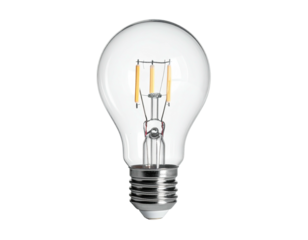 A clear glass light bulb glows with filament detail, isolated on black background