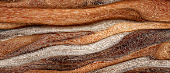 Earthy Tone Waves: A close-up shot of flowing, naturally textured waves in various shades of earthy tones evokes the depth and beauty of nature.