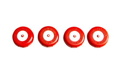 Red fire alarm button circle old mounted arranged in rows of several isolated on cut out PNG or transparent background. Alarm features clear labels. Emergency fire warning alert system equipment.