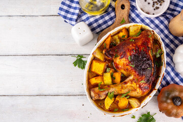 Roasted baked chicken quarter with pumpkin and potato stew
