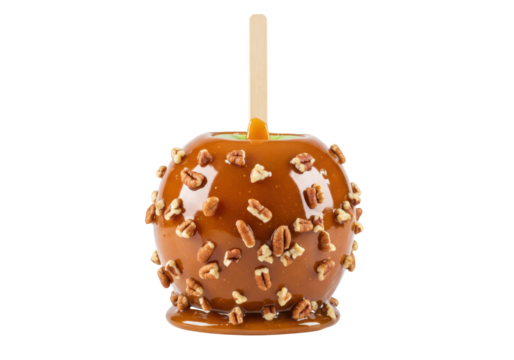 Delicious caramel apple with pecans isolated on transparent background, sweet treat for fall festivals and Halloween parties