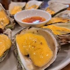 baked grilled oysters with cheese and hot pepper sauce, traditional asian food