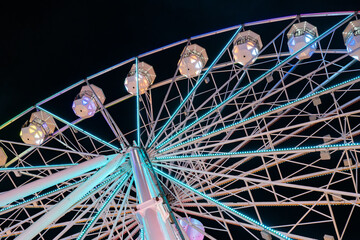 detail of a ferris wheel on a fair at night