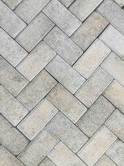 Gray paving stone pattern background with textured concrete blocks