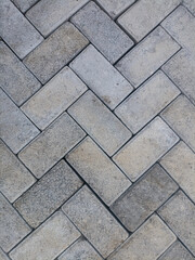 Gray paving stone pattern background with textured concrete blocks