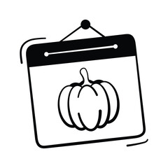 Calendar with pumpkin symbol representing October Halloween holiday.