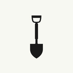 Black and white shovel for construction, digging and gardening tasks. Simple shovel isolated against a plain background symbolizes manual labor and digging work.