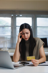 Fototapeta premium Woman getting stressed by financial problems