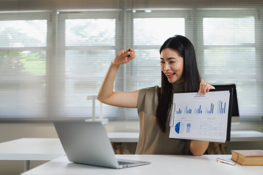 Young woman presenting business data during video call