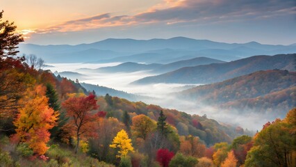 Sunrise view over misty autumn mountains and rolling hills with vibrant fall foliage.


