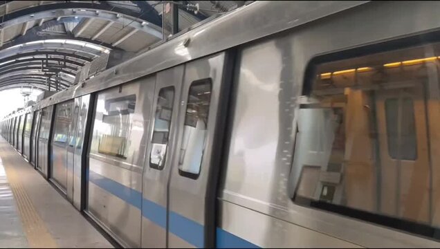 New Delhi, India, April 16 2025 - Delhi Metro train arriving at Jhandewalan metro station in New Delhi, India, Asia, Public Metro departing from Jhandewalan station