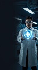 Asian doctor holds medical shield with cross symbol in hands.