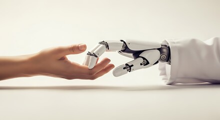 Human hand reaching out to touch a robot hand on white
