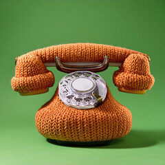 Handmade Knitted Retro Telephone on Olive Background