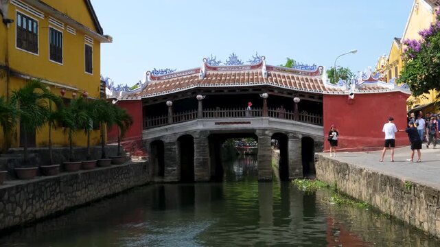 Historic Japanese Covered Bridge Hoi An Ancient Town, Vietnam. Famous UNESCO World Heritage site with wooden architecture, tiled roof, and lanterns. Popular tourist attraction and cultural landmark.