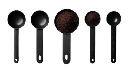 Black measuring spoons, coffee grounds