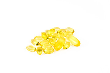 A pile of yellow pills on a white background